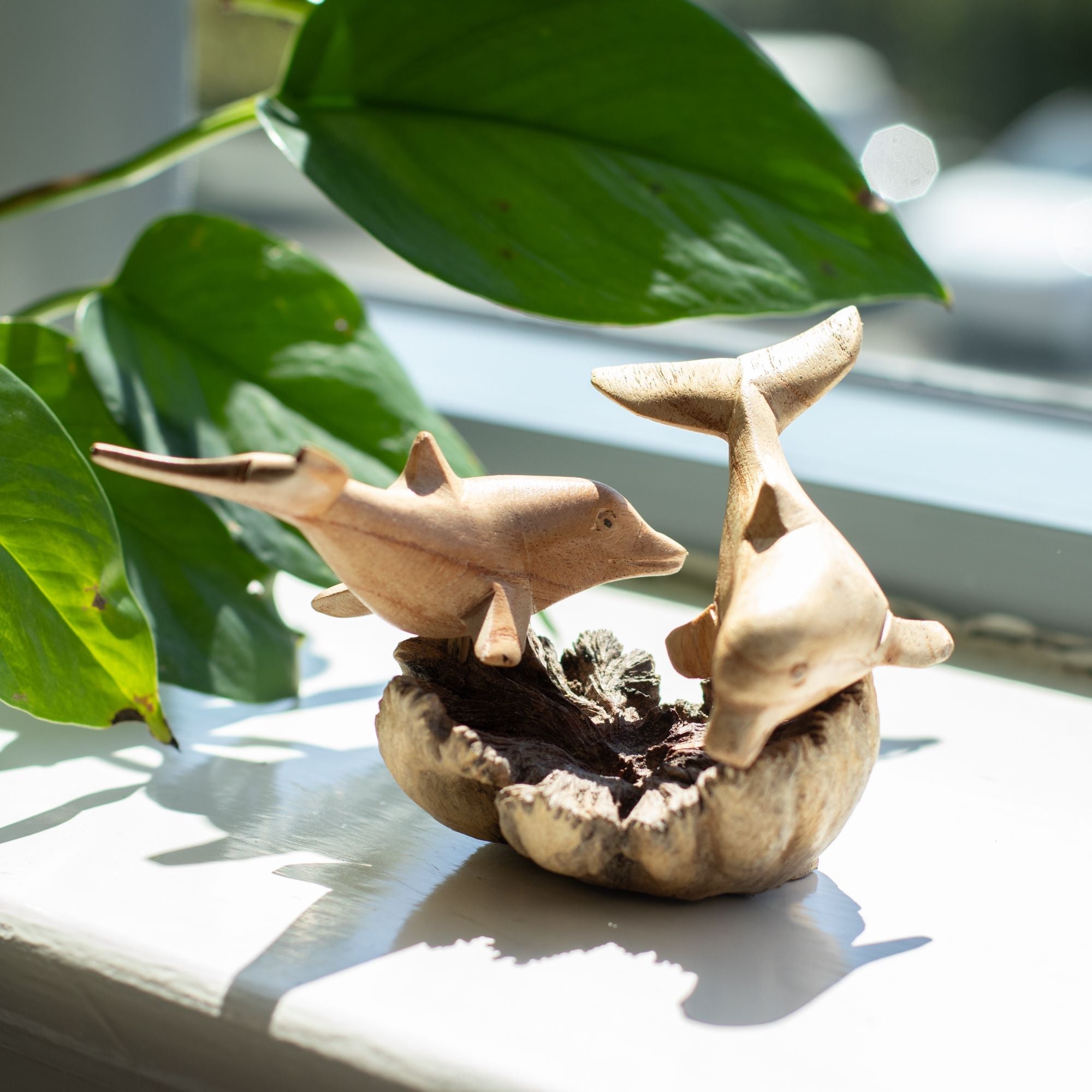 Hand-Carved Wooden Dolphin Sculpture on Parasite Wood Base